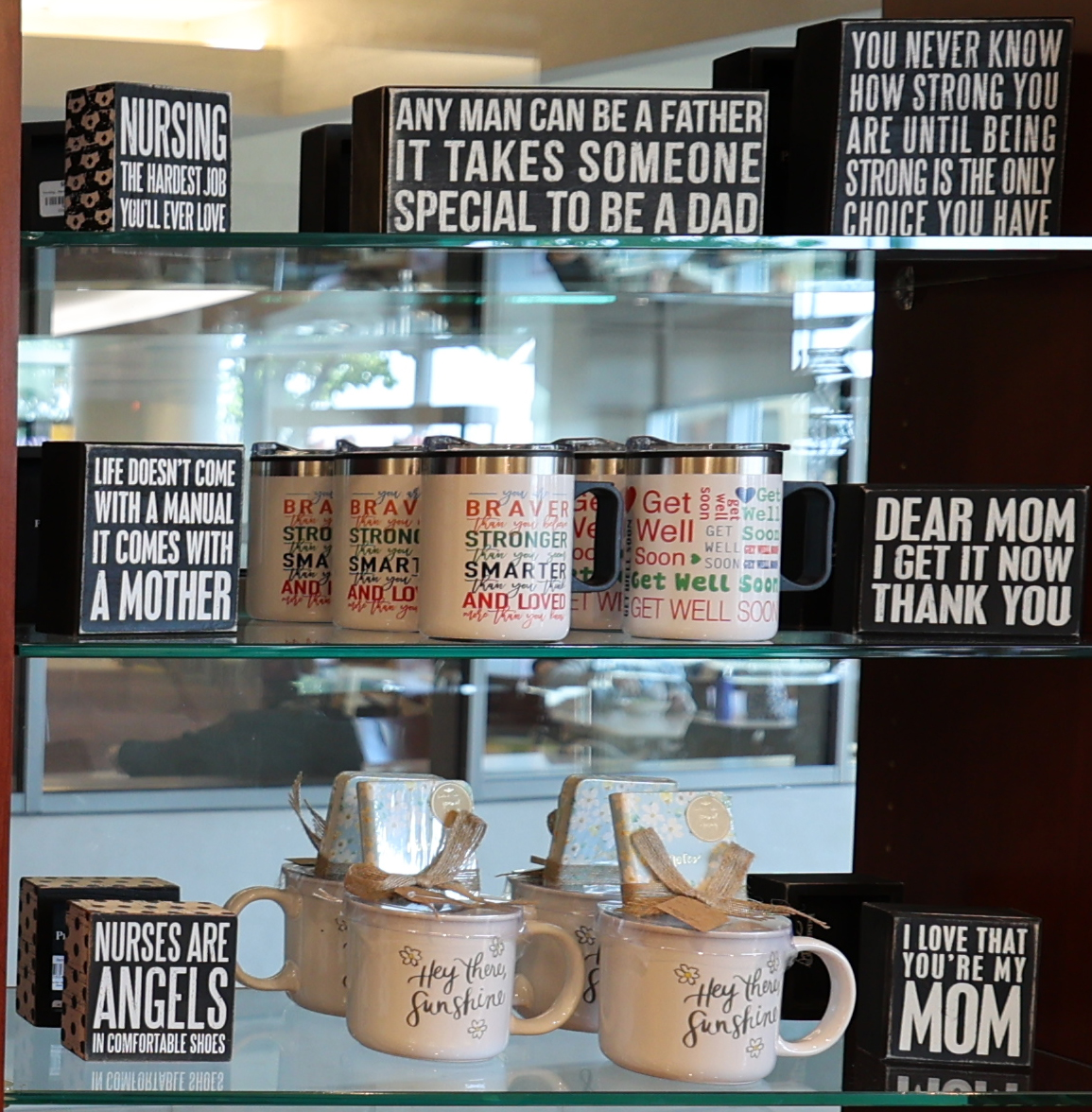 Box signs and coffee mugs at the Cloverkey gift shop in Delnor Community Hospital