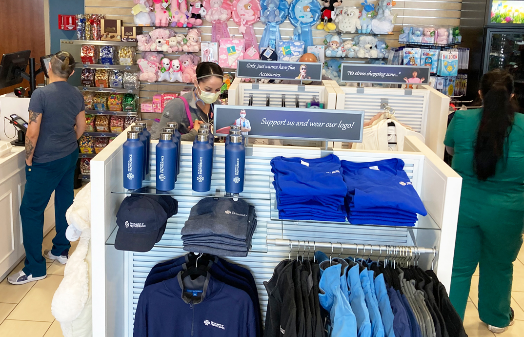 Visitors and hospital staff shop at the Cloverkey gift shop at The Hospitals of Providence - Transmountain Campus
