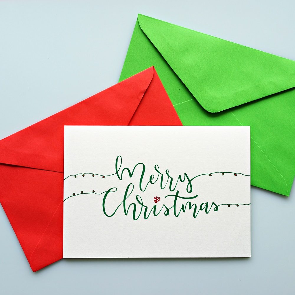 Hand drawn Christmas greeting card with envelope.